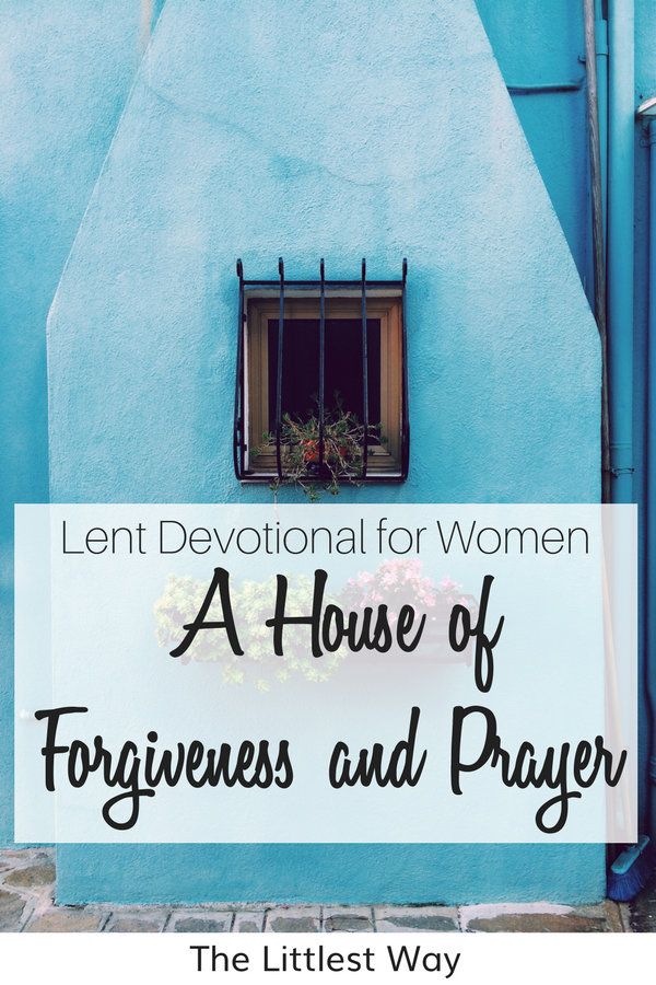 A blue house with a flower box to illustrate a house of forgiveness and prayer.