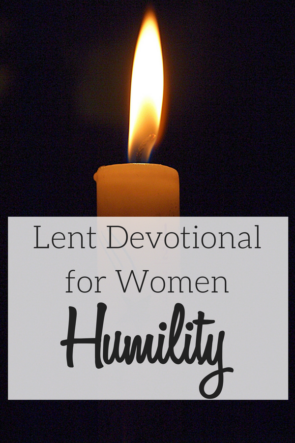 A single candle representing meditating on the virtue of humility for a Lent Devotional for Women.