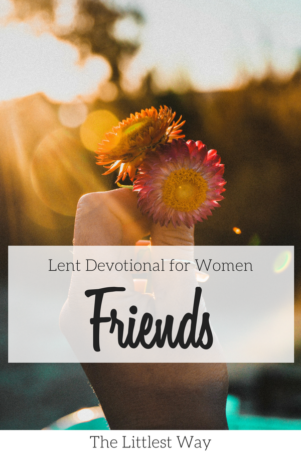 A women holding a flower as we talk about friendship again in the Lent Devotional for Women.